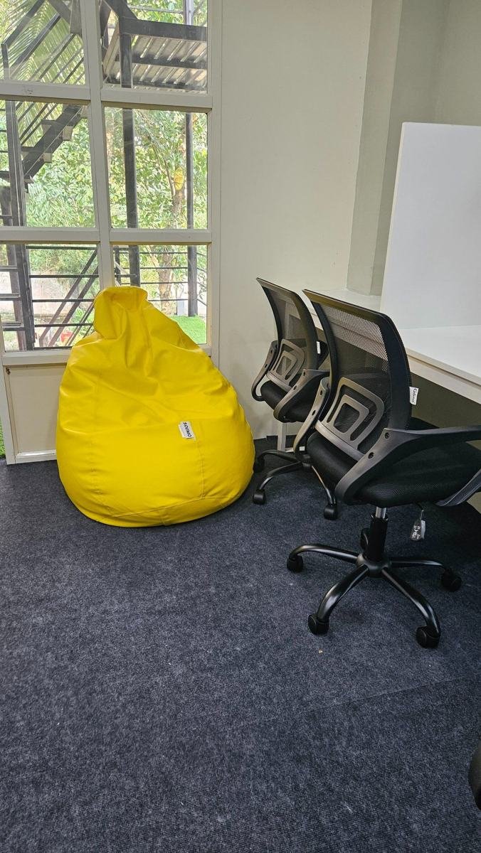 Window-side study seats with a yellow bean bag